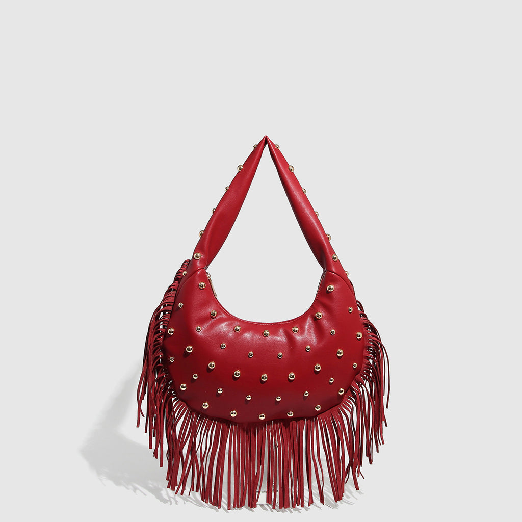 Bolso de hombro con flecos y tachuelas
