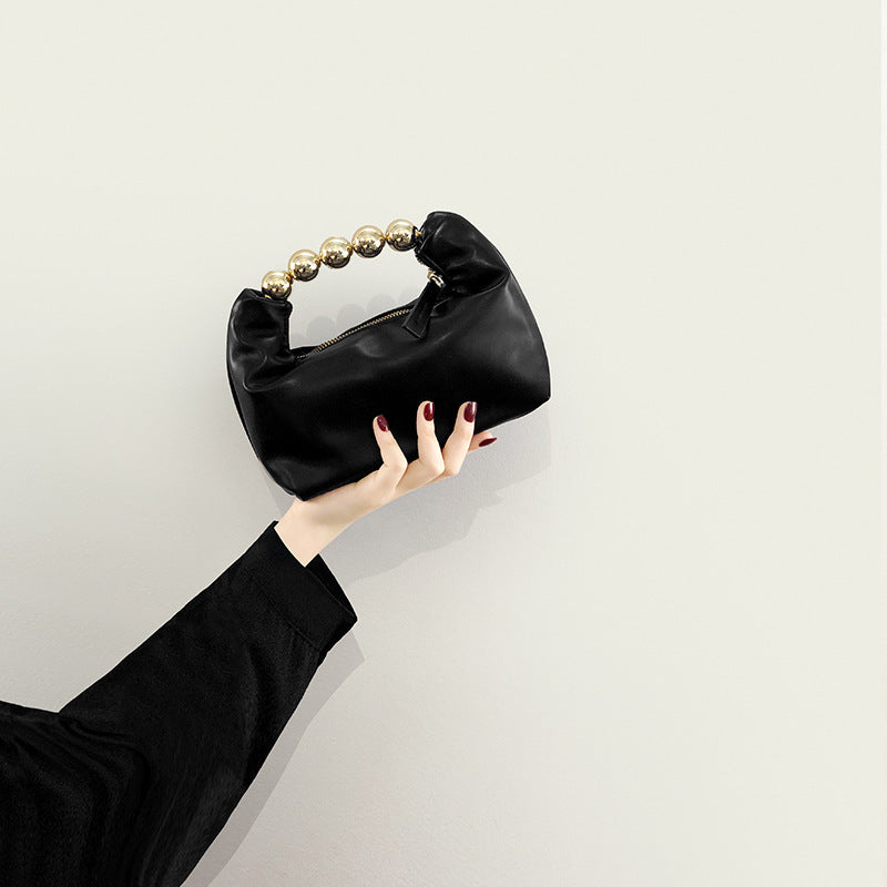 Bolso de mano con agarradero de perlas - bandolero