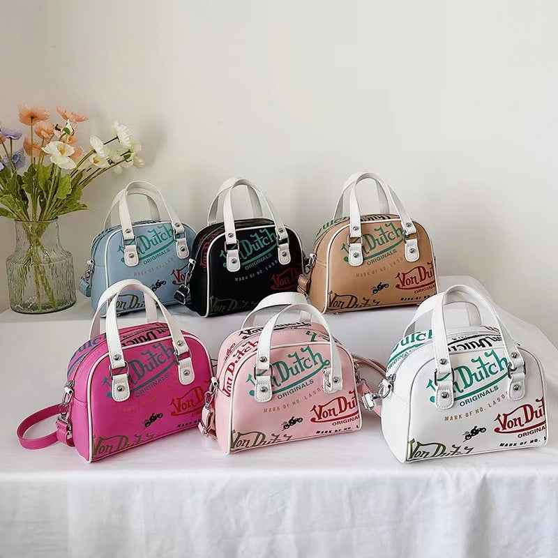 Bolso de mano y bandolera con grafiti Von Dutch