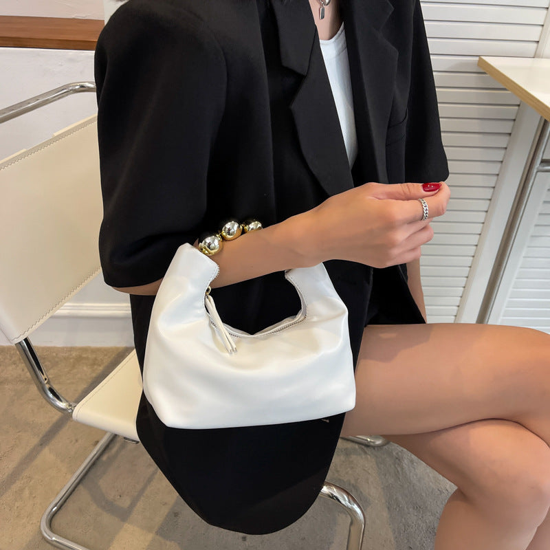 Bolso de mano con agarradero de perlas - bandolero